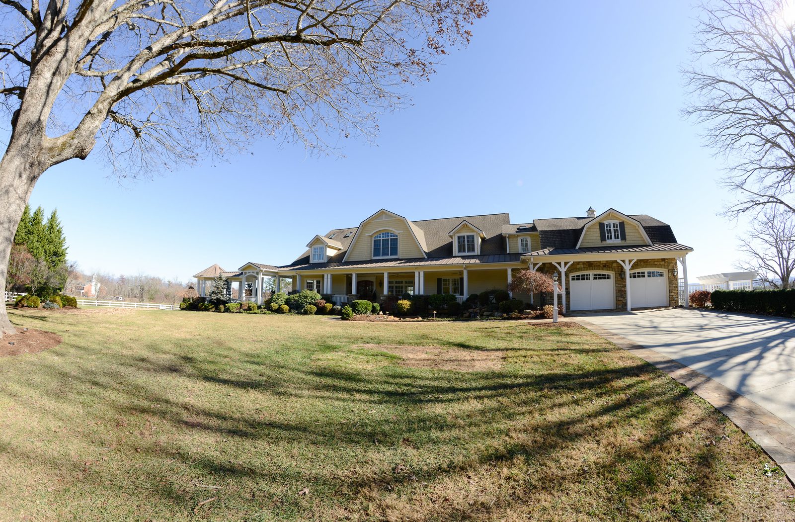 The estate seen across the lawn from the entrance drive