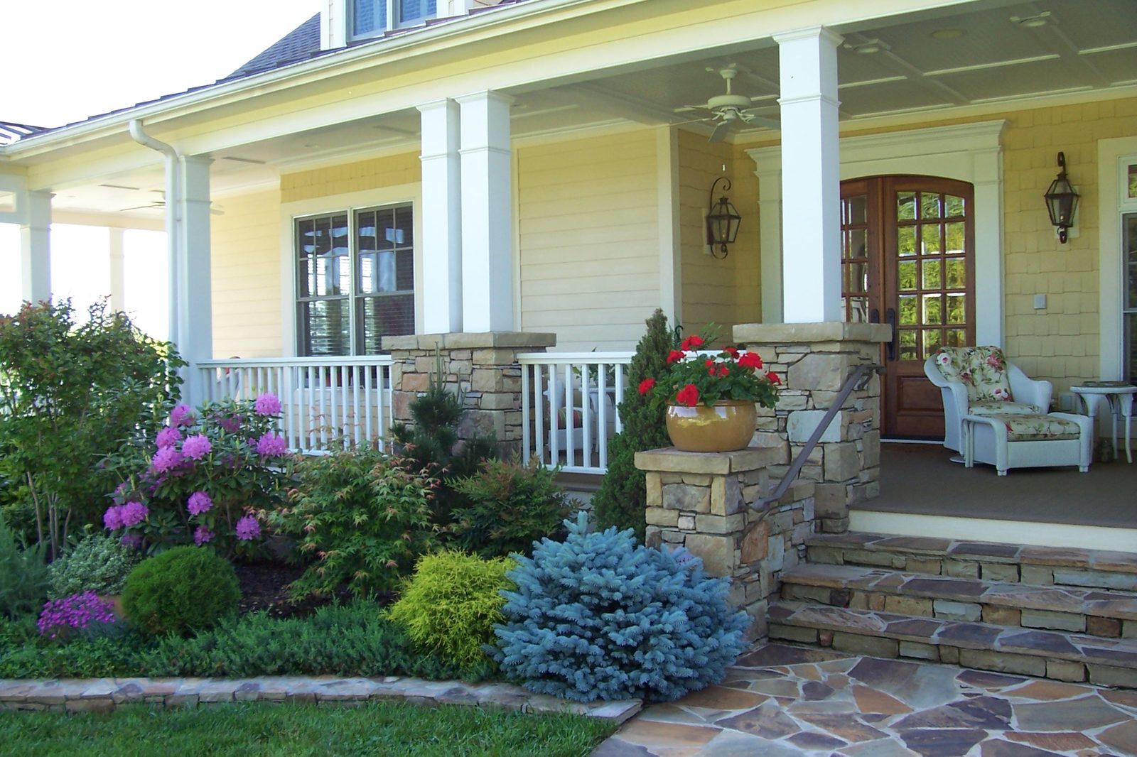 Covered porch entry with seating at the Silver Ridge estate