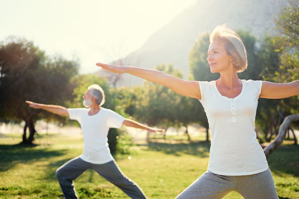 older-women-doing-yoga-outside Helpful Ways to Cope with Summer Cravings
