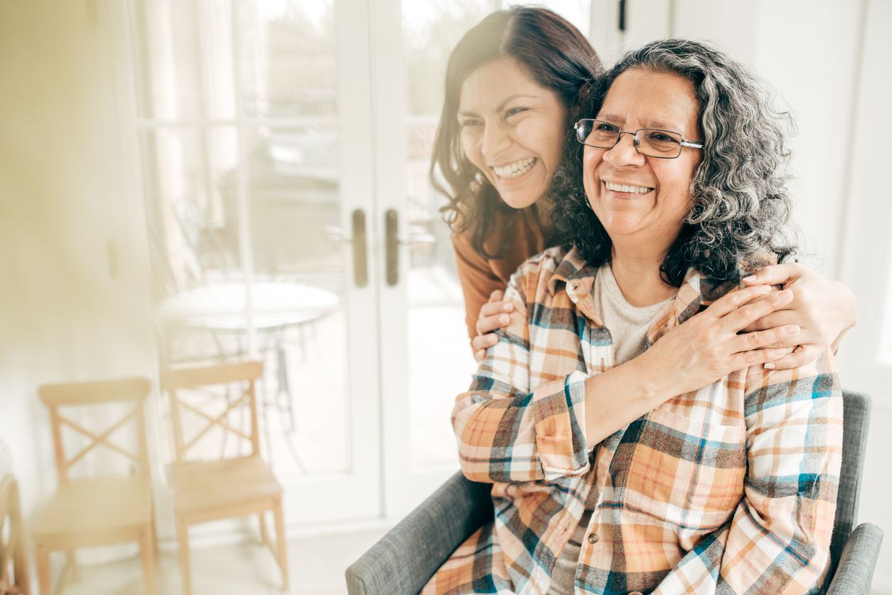 younger-daughter-hugging-older-mother-smiling How Your Family Plays a Role in Your Addiction and Recovery