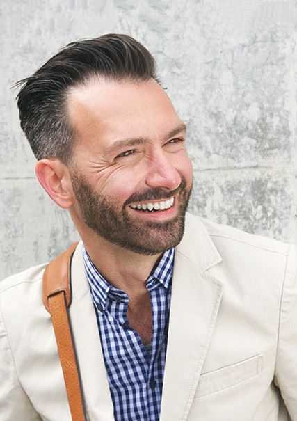 general-7 Adult caucasian male with slicked back hair smiling