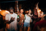 Group of young adults partying consuming alcohol