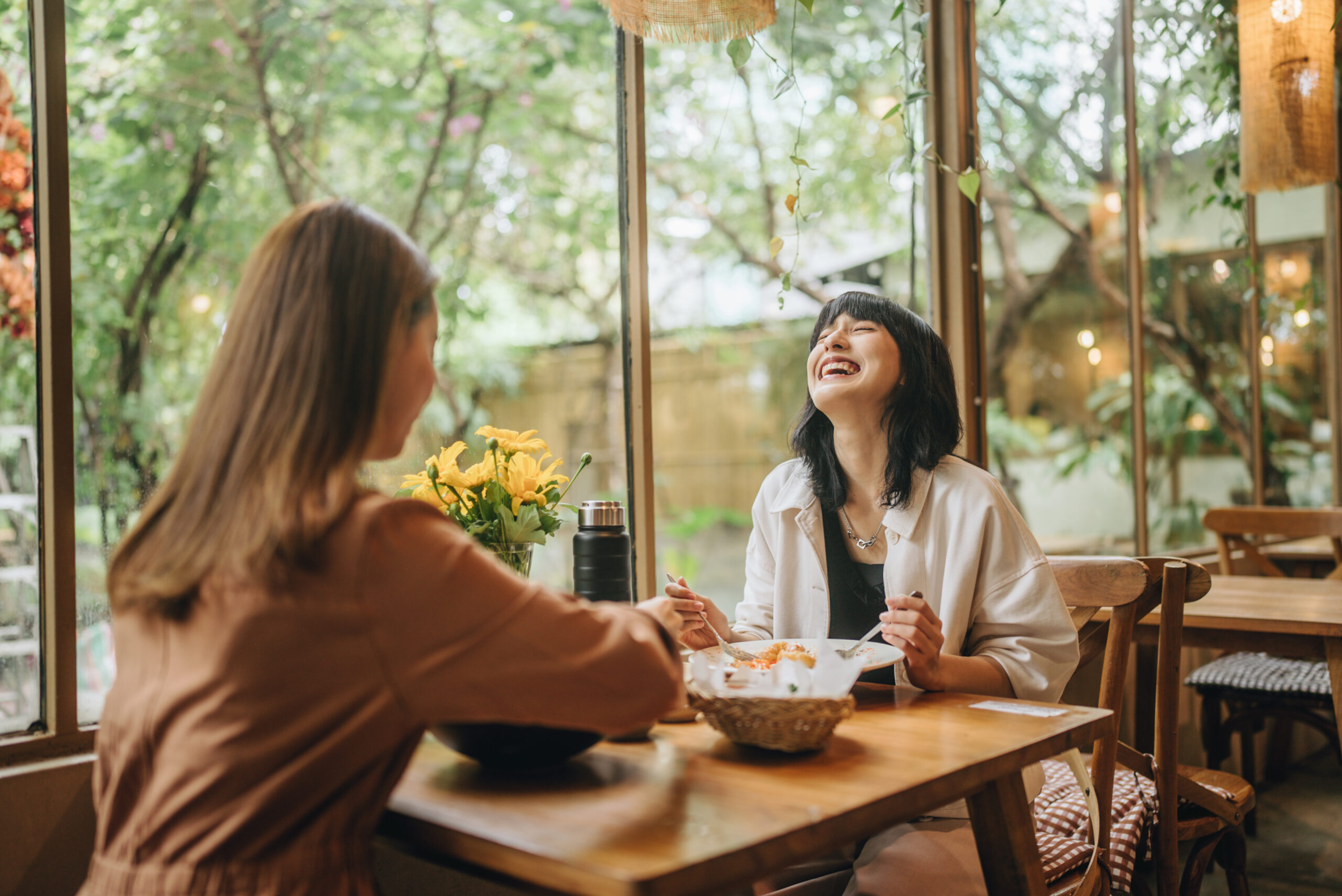 A pair of friends enjoying a delicious meal together as a support group for each other